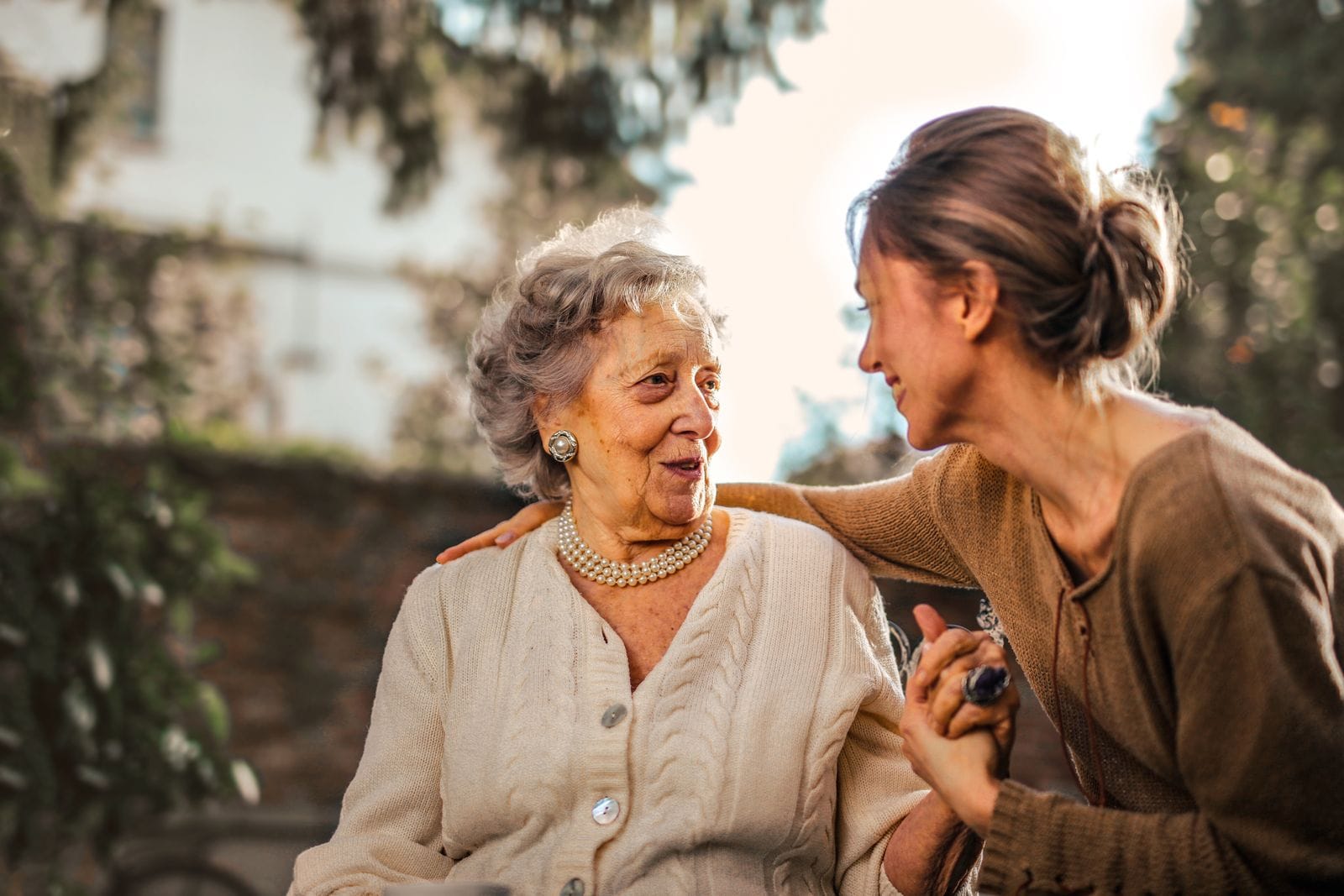 Caregiver offering supportive guidance to a senior rider